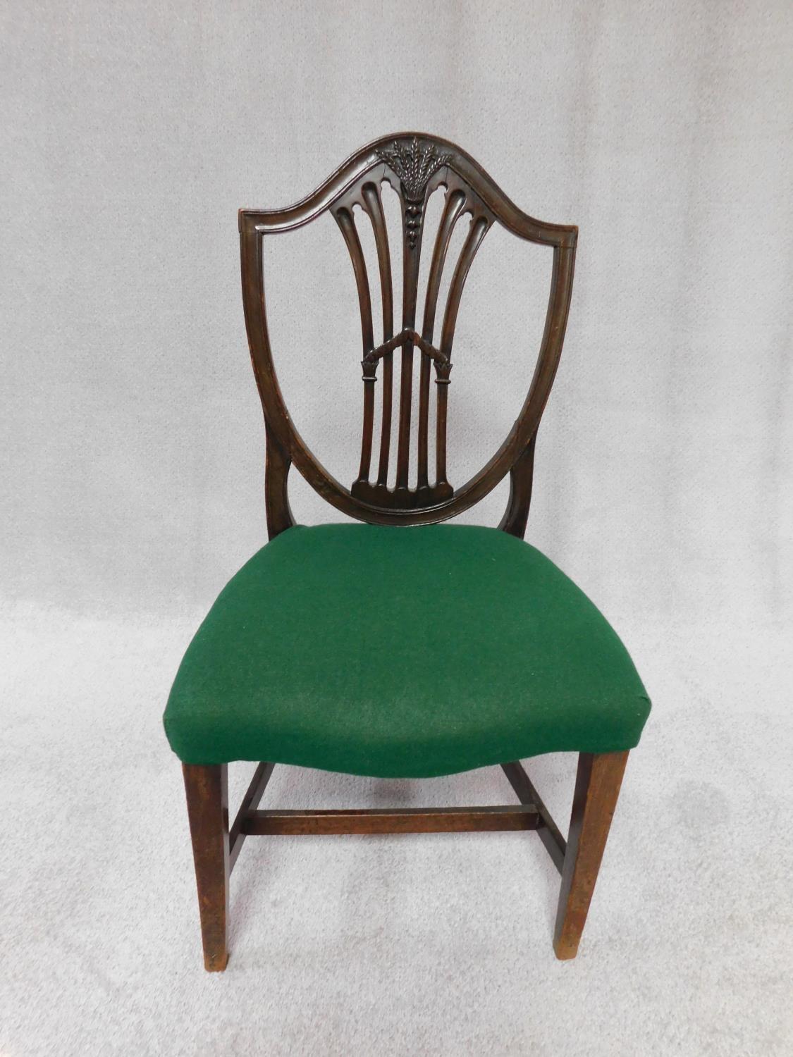 A set of three 19th century mahogany dining chairs with Hepplewhite style shield shaped pierced - Image 2 of 3