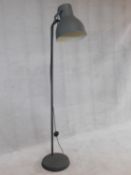 A contemporary vintage industrial style adjustable floor standing reading lamp. H.182cm