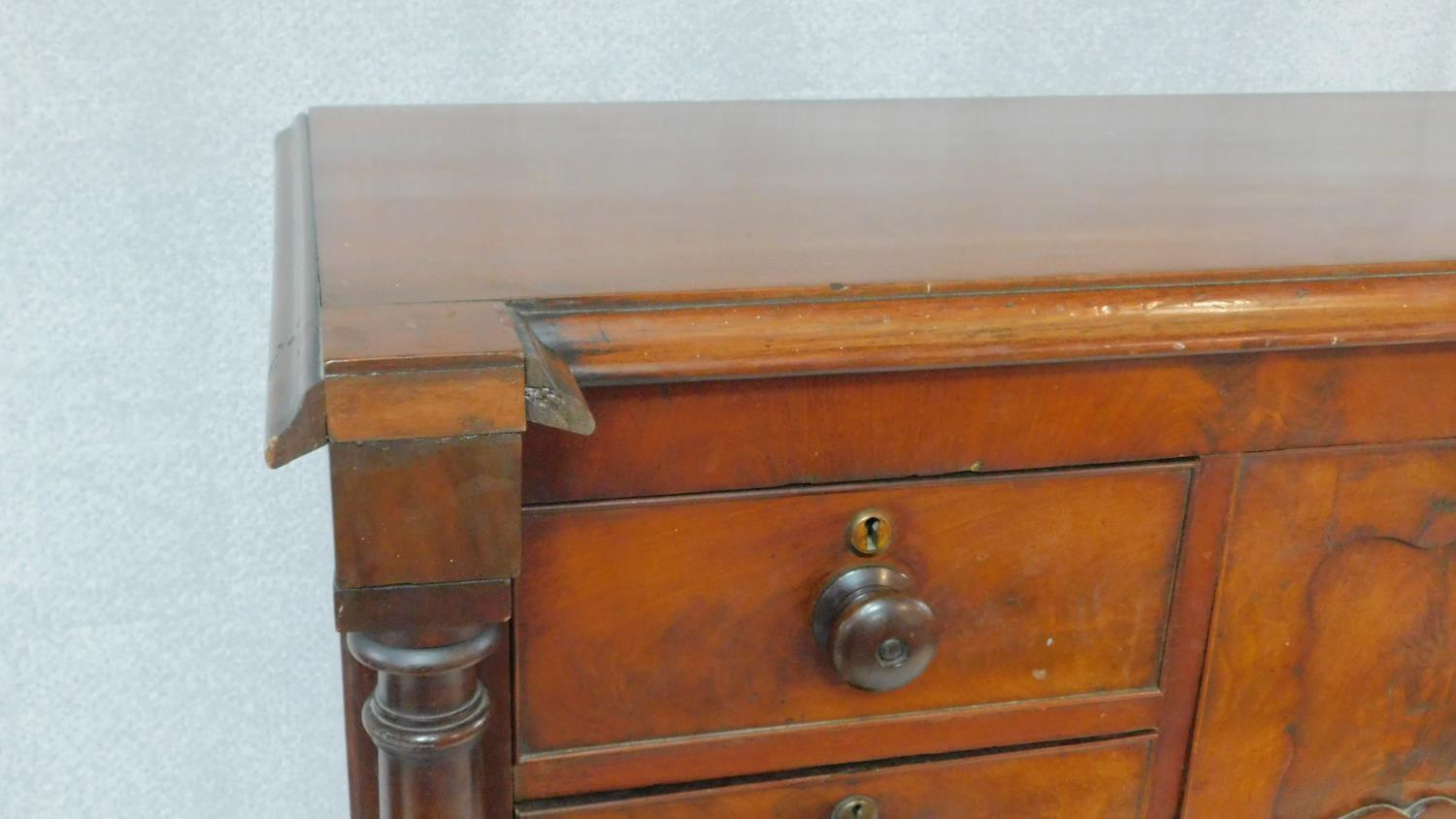 A Victorian figured mahogany chest of drawers with central hat drawer and an arrangement of seven - Image 6 of 8