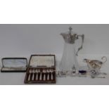 A collection of silver plated items. Including a cased set of cake forks, cut glass and silver