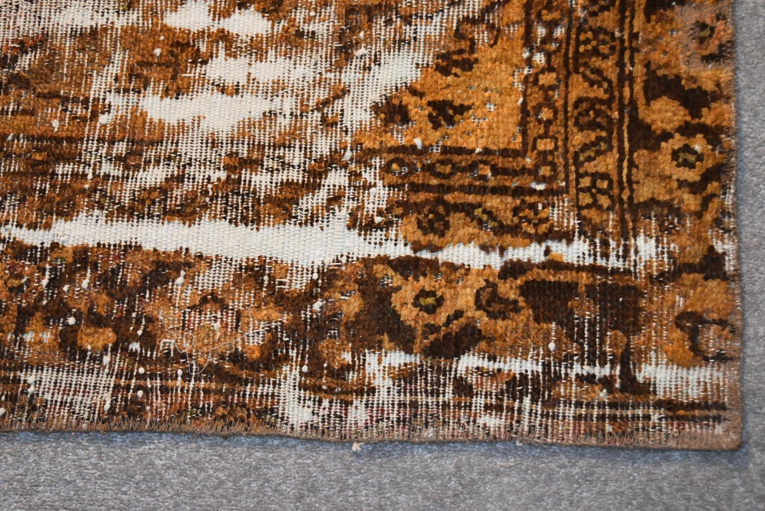 A redied Persian rug with central medallion on a russet ground within geometric multi borders. L. - Image 3 of 4
