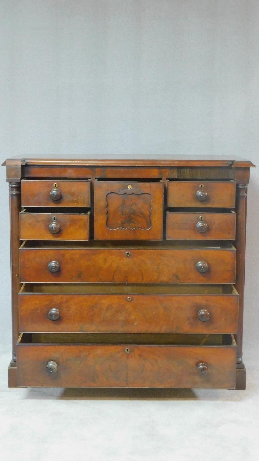 A Victorian figured mahogany chest of drawers with central hat drawer and an arrangement of seven - Image 3 of 8