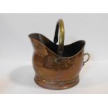 A vintage copper helmet shaped coal bucket with brass swing handle. 35x38cm