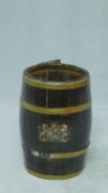 An antique brass banded and oak barrel shaped stick/umbrella stand with painted royal crest, with