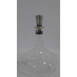 A silver plated and crystal Cristofle wine decanter. The matching stopper has a ribbed design and it