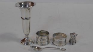 A collection of silver. Including a silver rattle in the form of a kitten hallmarked WA for