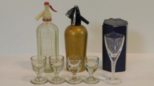 A collection of glassware. Including four antique shot glasses, a boxed Stuart crystal air twist