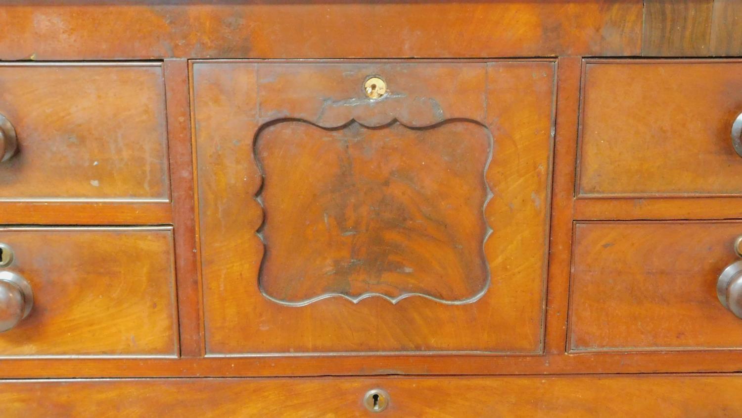 A Victorian figured mahogany chest of drawers with central hat drawer and an arrangement of seven - Image 8 of 8