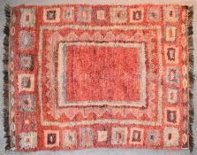 A contemporary rug with geometric design on rouge field. L.195x150cm