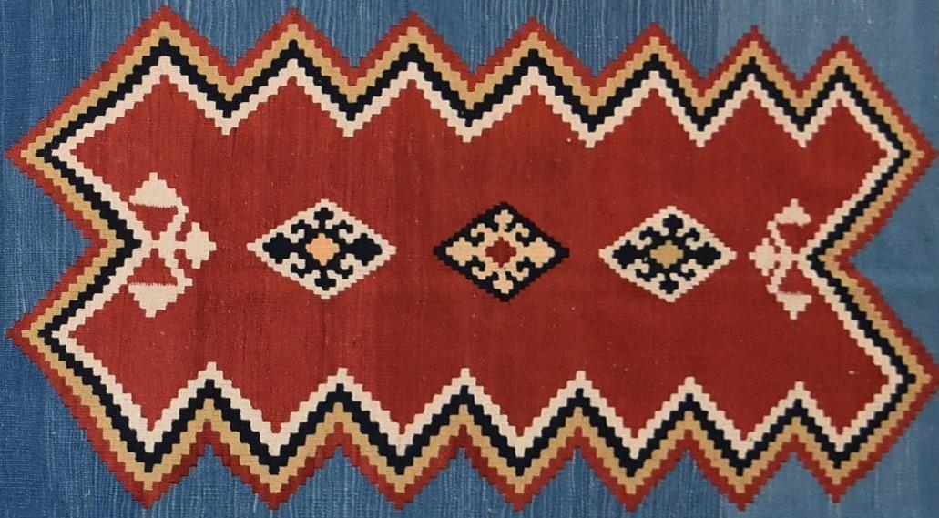 A Qashgai Kilim with central medallion on burgundy ground within multiple geometric borders. H. - Image 2 of 3