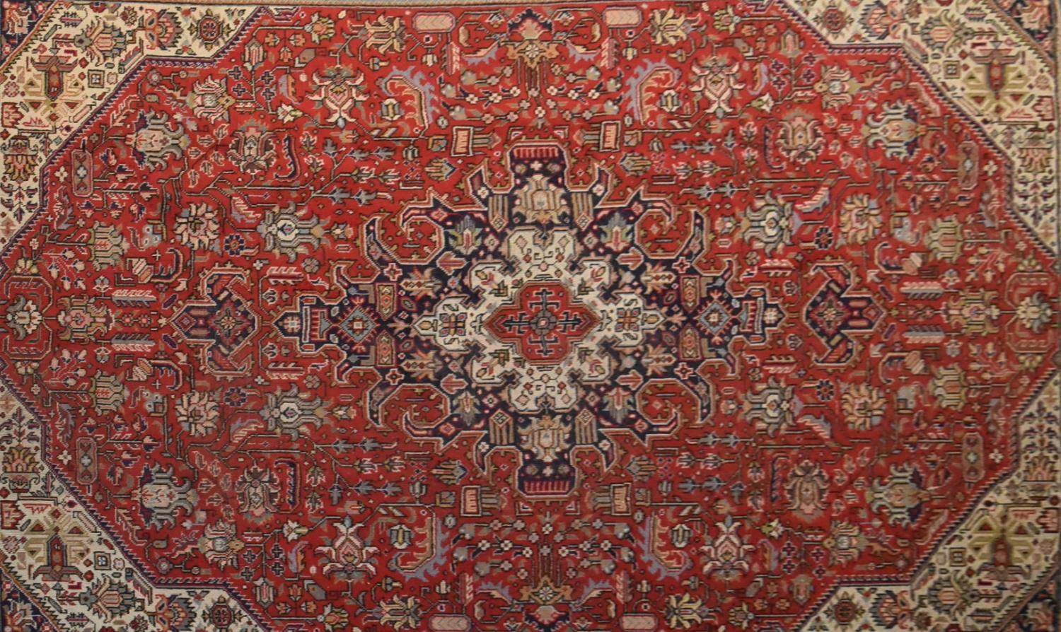 A Persian Tabriz carpet with floral central double pendant medallion surrounded by spandrels on a - Image 2 of 4