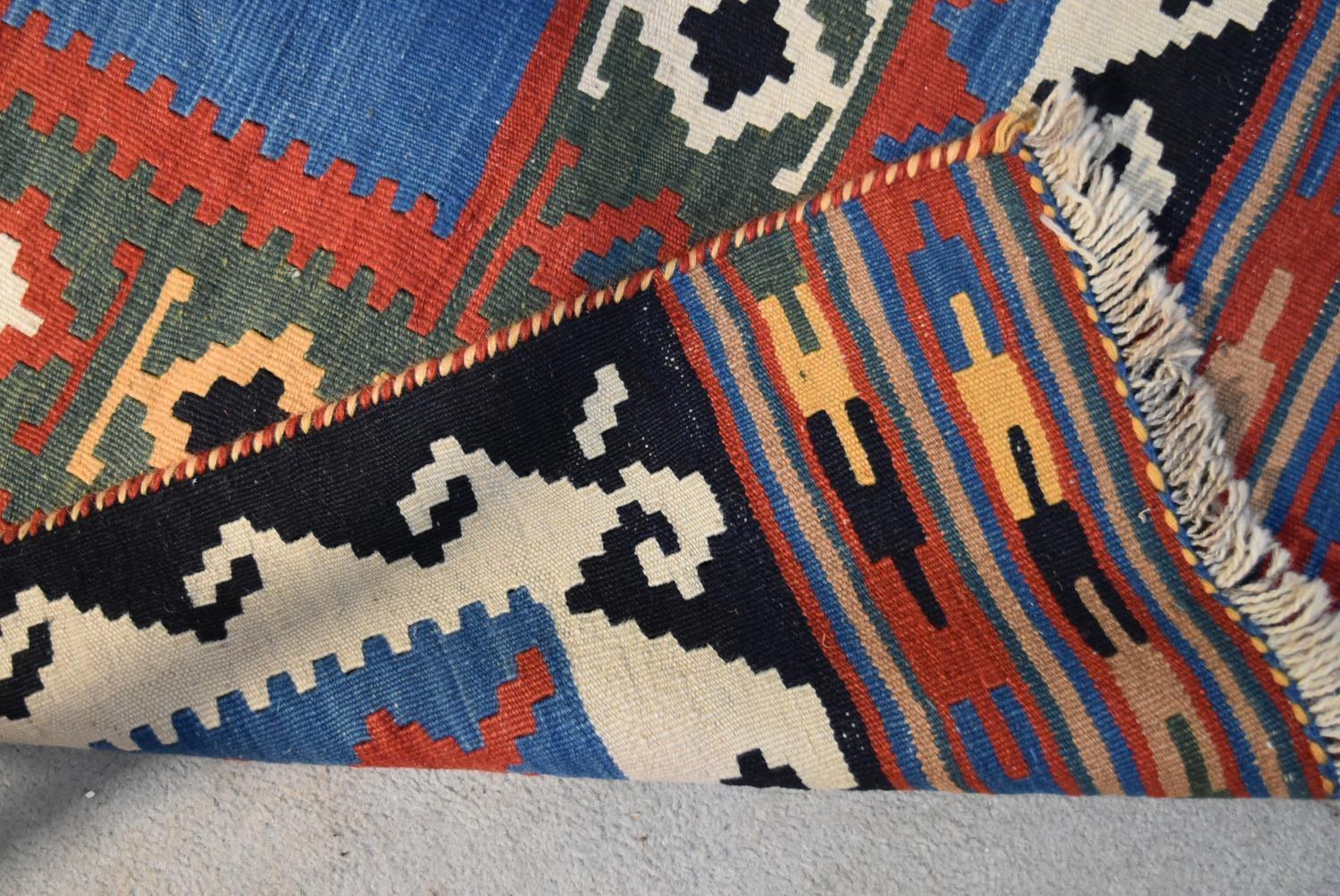 A Qashgai Kilim with central medallion on burgundy ground within multiple geometric borders. H. - Image 3 of 3