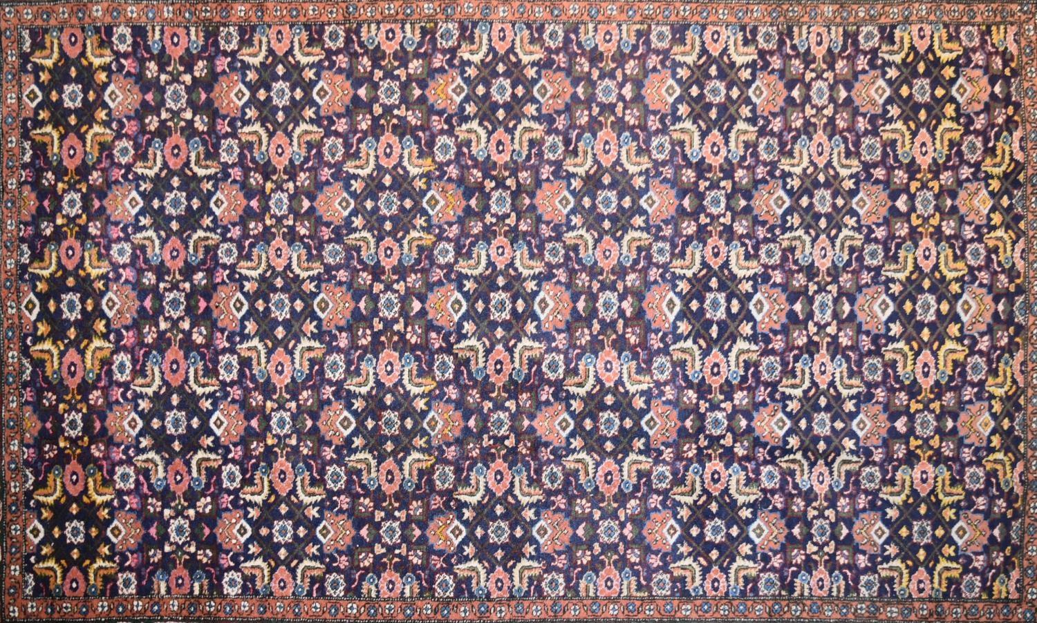 An Indian rug with repeating lozenge and foliate motifs on a deep sapphire ground contained within - Image 2 of 4