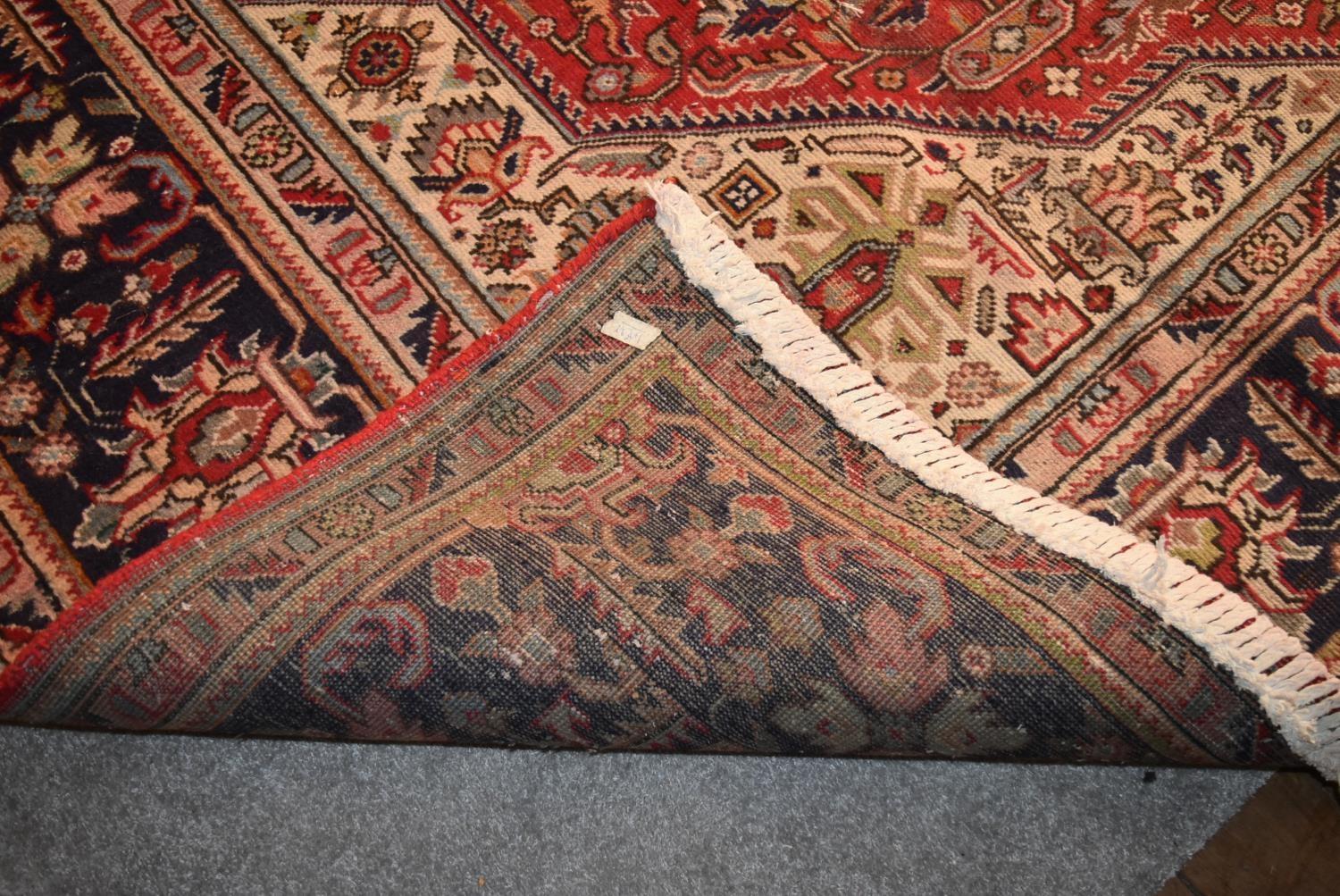 A Persian Tabriz carpet with floral central double pendant medallion surrounded by spandrels on a - Image 4 of 4