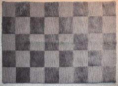 A contemporary rug with grey chequerboard pattern. L.144x94cm