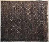 A contemporary carpet with allover scrolling interlocking pattern on a deep bronze ground. L.