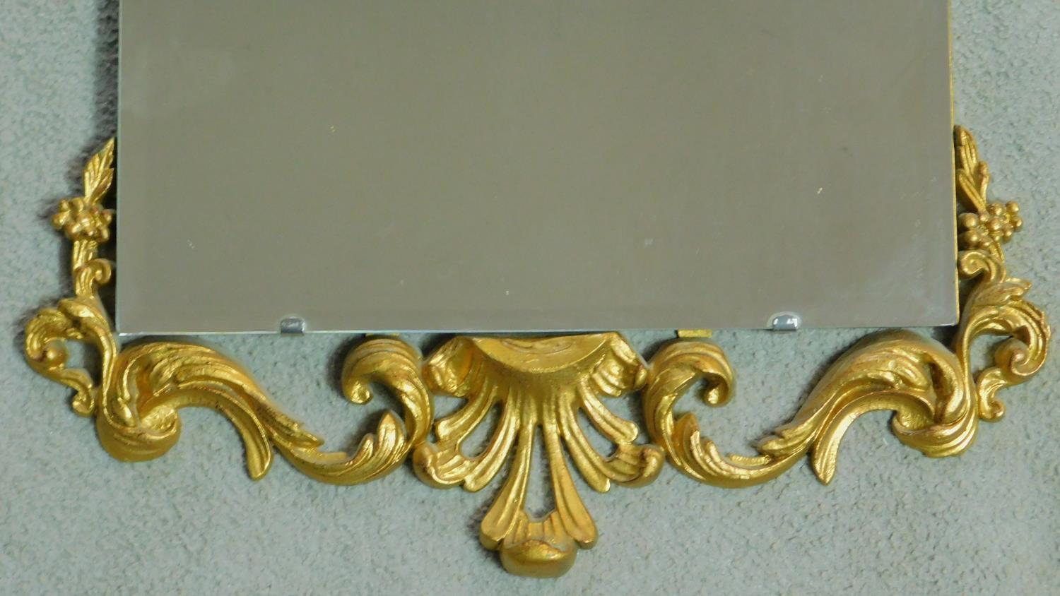 A mid century pier mirror with bevelled glass and gilt Rococo style frame. 47x104cm - Image 3 of 4