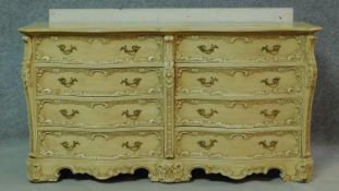 a mid century vintage cream and gilt bombe style chest of drawers fitted with an arrangement of