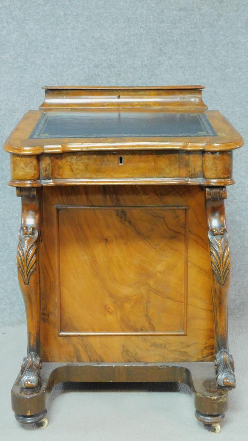 A Victorian burr walnut Davenport with fitted satinwood lined interior and four drawers opposing