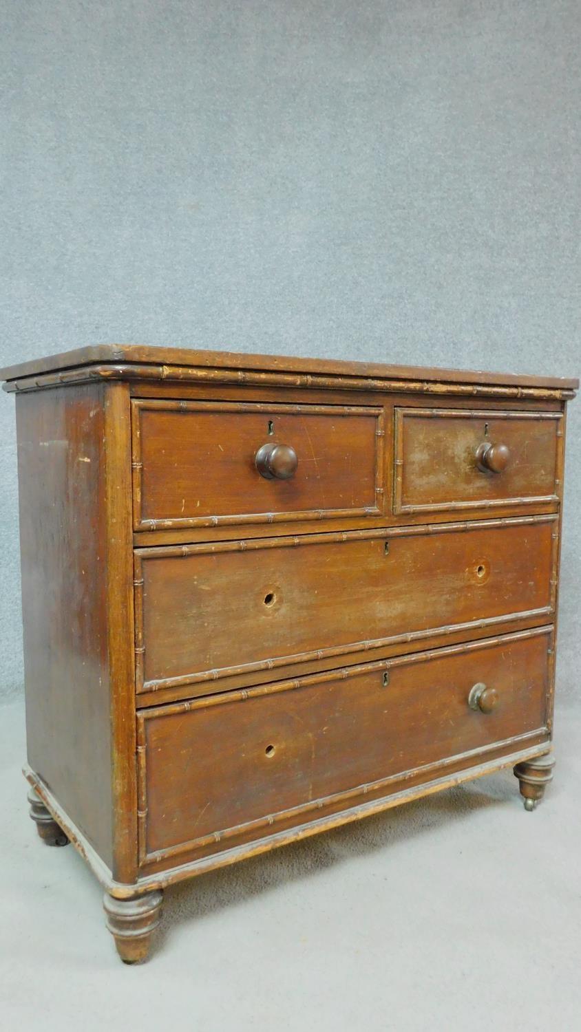 An early 19th century pitch pine chest of drawers with faux bamboo mouldings raised on squat - Image 2 of 6