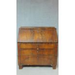 A 19th century flame mahogany Continental Biedermeier bureau with fall front revealing fitted