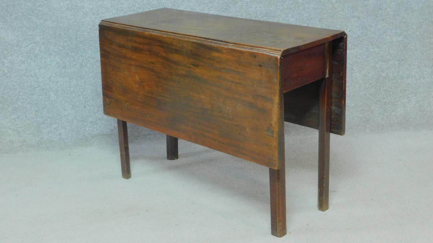 A Georgian mahogany drop flap dining table with gateleg action on square supports. H.72 W.115 D.95cm - Image 3 of 3