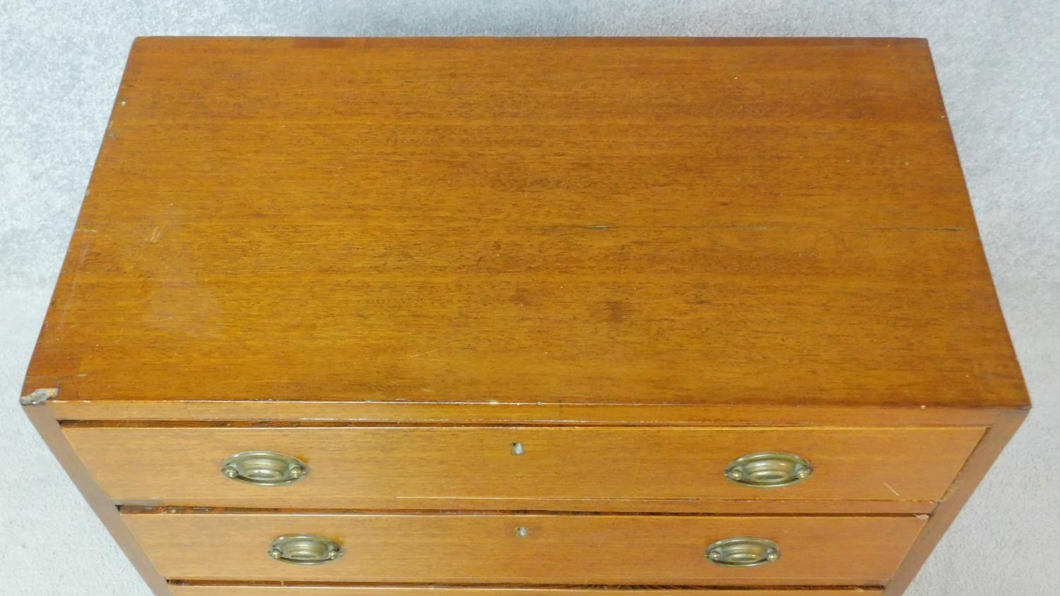 A Georgian mahogany chest of four graduating drawers of compact size on bracket feet. H.81 W.71 D. - Image 4 of 8