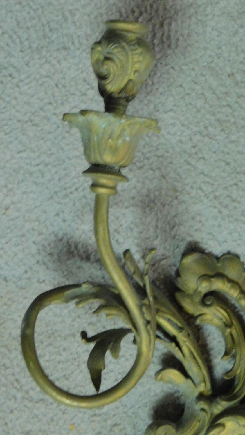 A pair of gilt metal Rococo style twin branch wall candelabras. H.40 W.28cm (previously wired for - Image 3 of 6