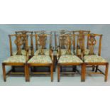 A set of eight 20th century Chippendale style oak dining chairs with pierced splat back and drop