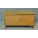 A 19th century pine plank coffer with hinged lidded top. H.41 W.80 D.34cm