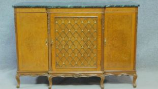 A Louis XV style walnut breakfront credenza with veined marble top on carved cabriole supports. H.94