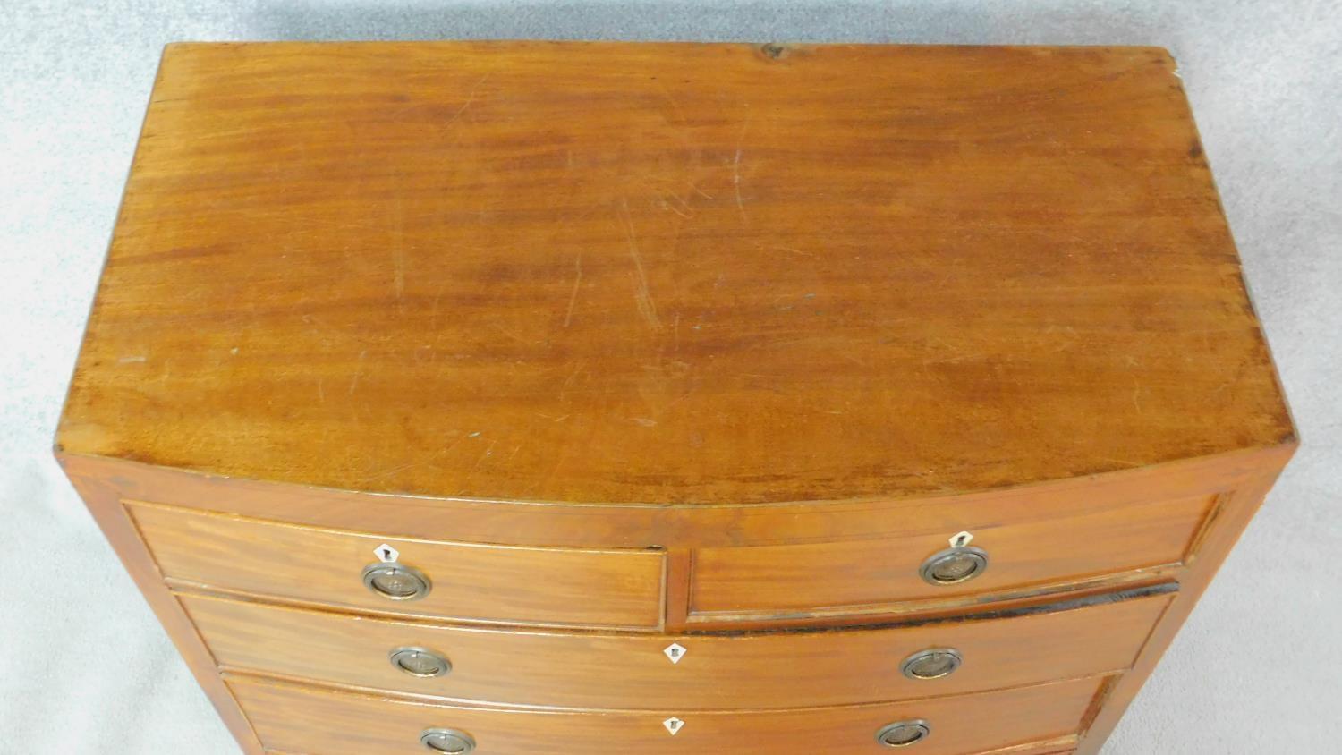 A Regency mahogany bowfronted chest of drawers with ebony inlay to the frieze and with ivory - Image 4 of 5