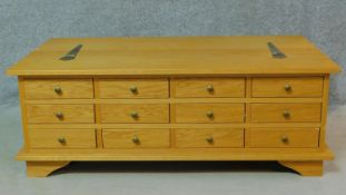 A contemporary bank of spice drawers with hinged lidded storage section. H.43 W.120 D.66cm