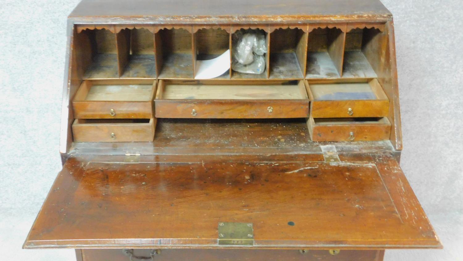 A Georgian mahogany bureau with fall front revealing fitted interior above four graduated drawers on - Image 3 of 7