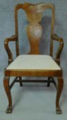 A late 19th century oak early Georgian style armchair with vase splat back and drop in seat raised