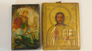 Two religious Russian icons on panel. One open like a book with a printed religious scene