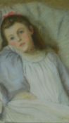 A framed and glazed pastel of a child, indistinctly signed. 67x57cm