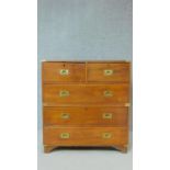 A 19th century two section teak brass bound military chest with two short over three long drawers on