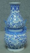 A Chinese blue and white double gourd shaped vase with twin carrying handles. H.49cm