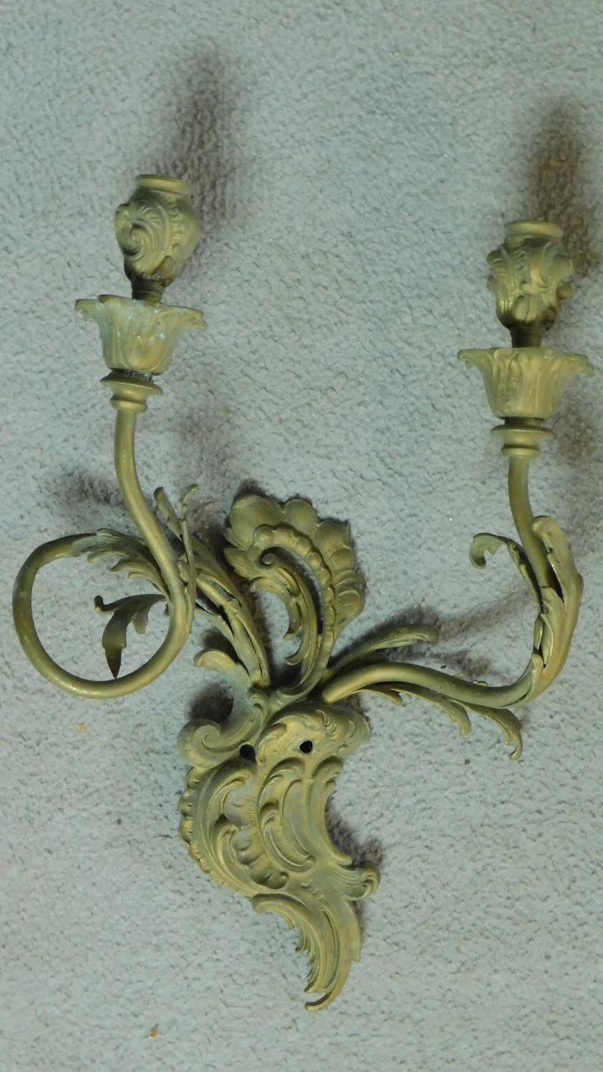 A pair of gilt metal Rococo style twin branch wall candelabras. H.40 W.28cm (previously wired for - Image 2 of 6