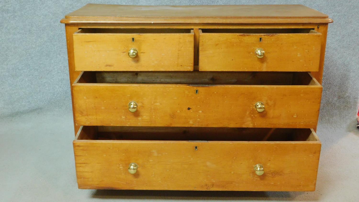 A Victorian pine chest of two short over two long drawers on plinth base. H.74 W.108 D.48cm - Image 2 of 5