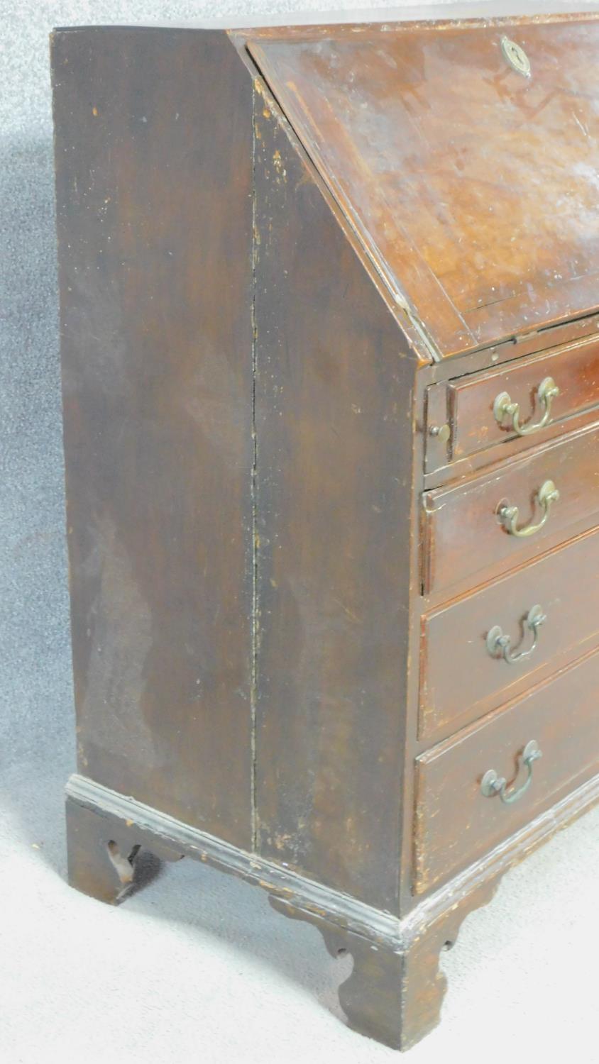A Georgian mahogany bureau with fall front revealing fitted interior above four graduated drawers on - Image 5 of 7