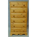 A Victorian style pine tall chest of six drawers on shaped bracket feet. H.123 W.63 D.45cm
