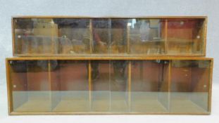 A mid century vintage oak two section Unix bookcase with makers label to the inside. H.67 W.135 D.
