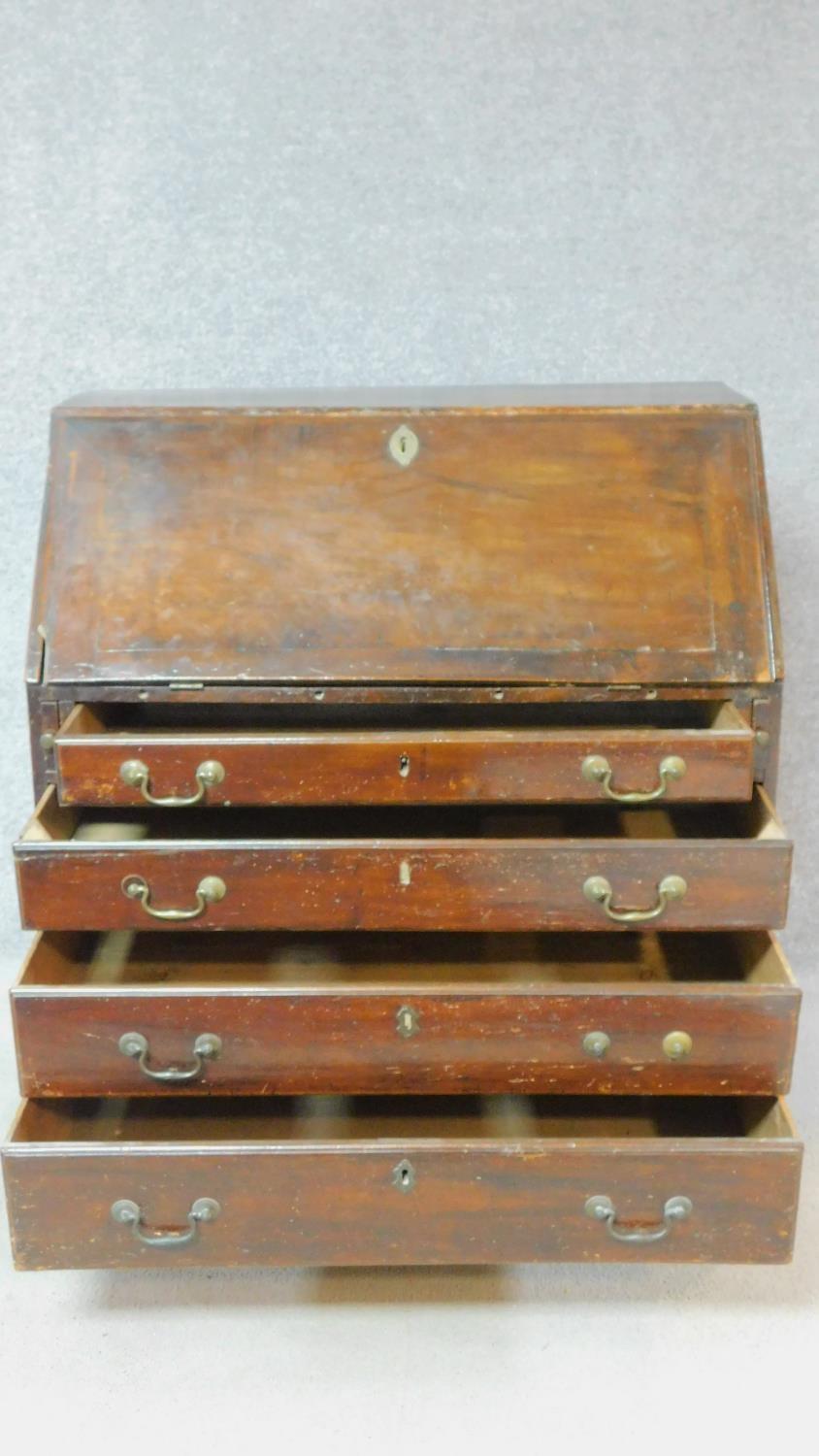 A Georgian mahogany bureau with fall front revealing fitted interior above four graduated drawers on - Image 4 of 7