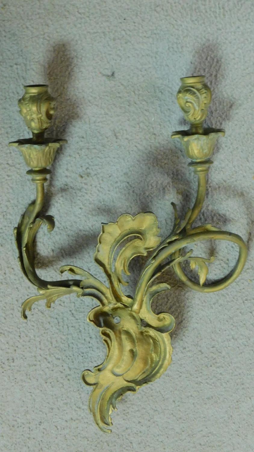 A pair of gilt metal Rococo style twin branch wall candelabras. H.40 W.28cm (previously wired for - Image 6 of 6