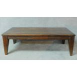 A Eastern teak low coffee table with pegged and cleated planked top. H.45 W.140 D.70cm