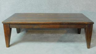 A Eastern teak low coffee table with pegged and cleated planked top. H.45 W.140 D.70cm
