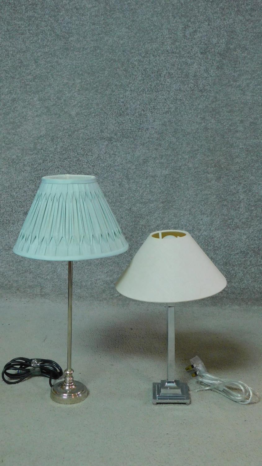 Two contemporary chrome pedestal table lamps with shades. H.52cm