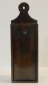 An antique wall hanging oak candle box with sliding front panel. H.46 W.15 D.9cm